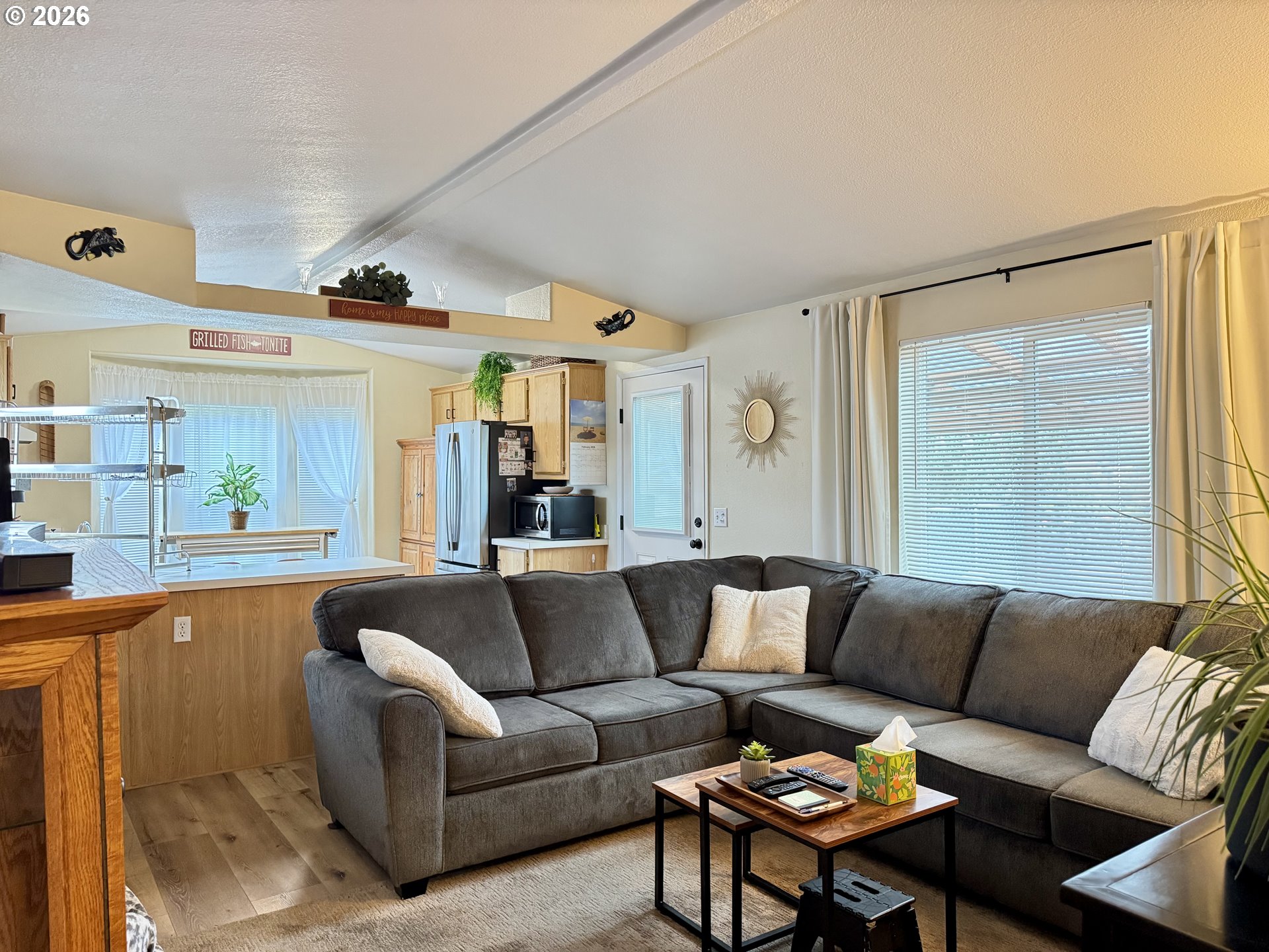 3760 Highway 101, Unit 1 Florence, OR 97439 - Photo 15 of 32 a living room with furniture and a large window
