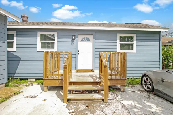 a front view of a house with parking