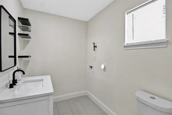 a bathroom with a sink and a toilet