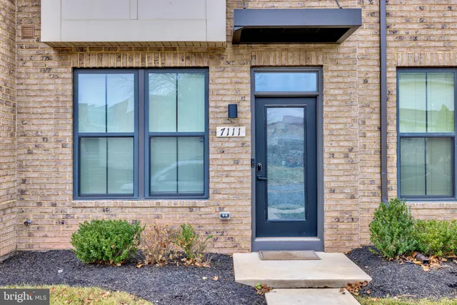 a kitchen with stainless steel appliances kitchen island granite countertop a kitchen island hardwood floor sink and stove