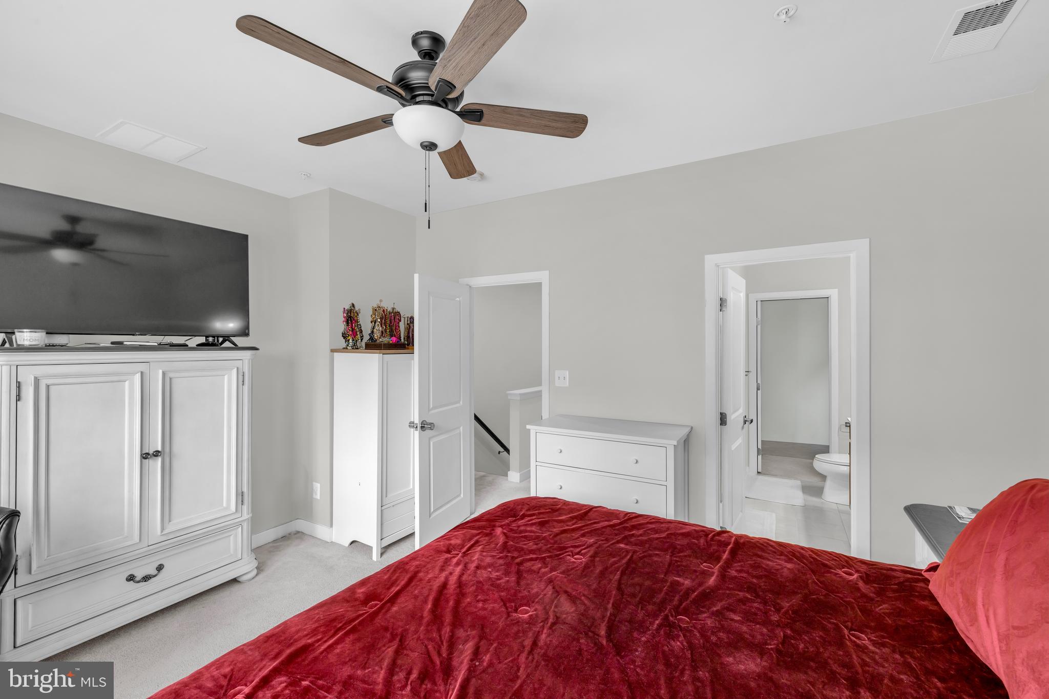 7111 Sollers Point Road Baltimore, MD 21222 - Photo 11 of 61 a bedroom with a bed and a flat screen tv