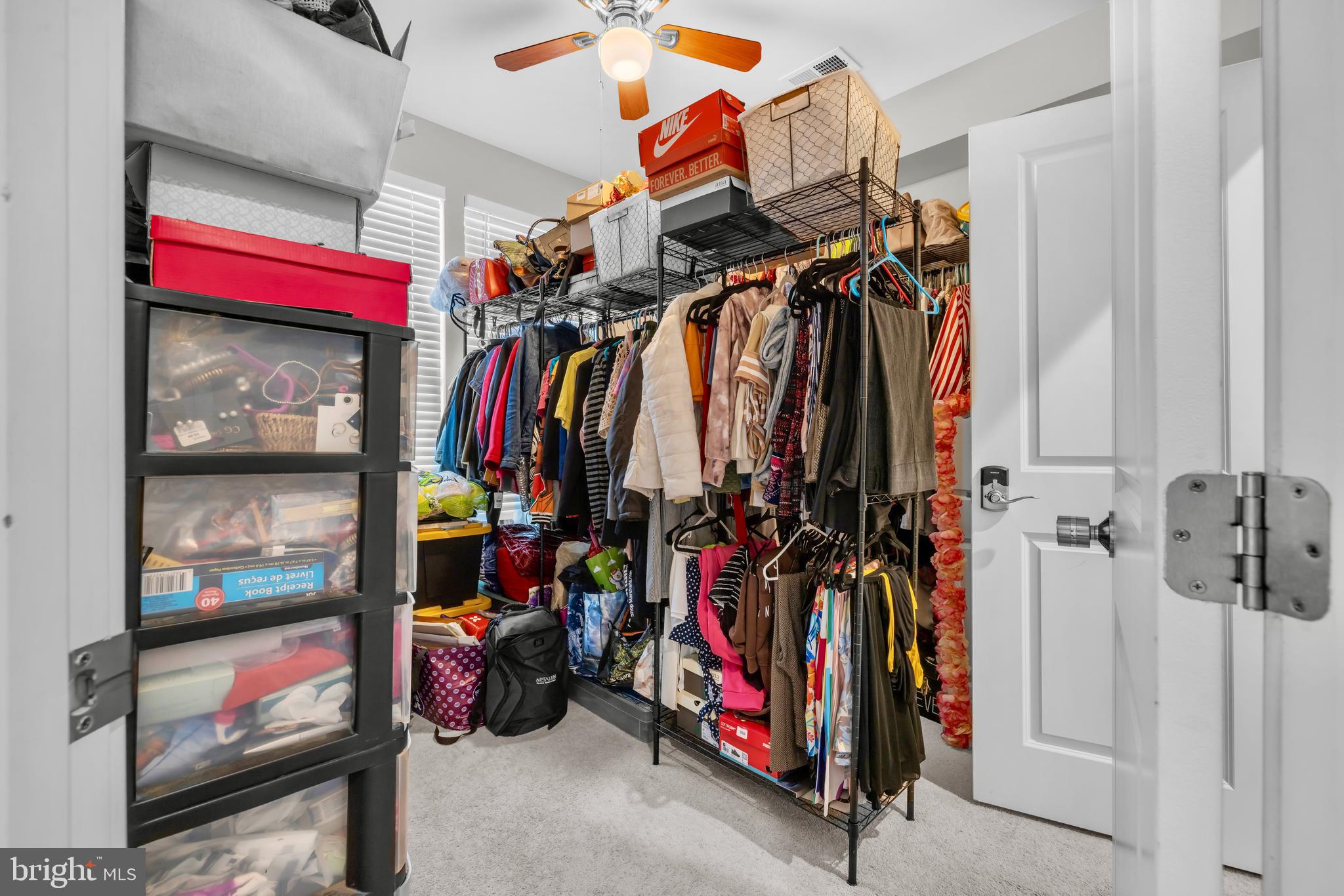 7111 Sollers Point Road Baltimore, MD 21222 - Photo 14 of 61 a view of walk in closet with clothes and shoes