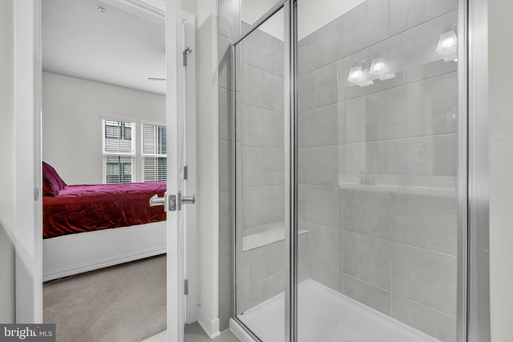 7111 Sollers Point Road Baltimore, MD 21222 - Photo 17 of 61 a bedroom with a bed and a window