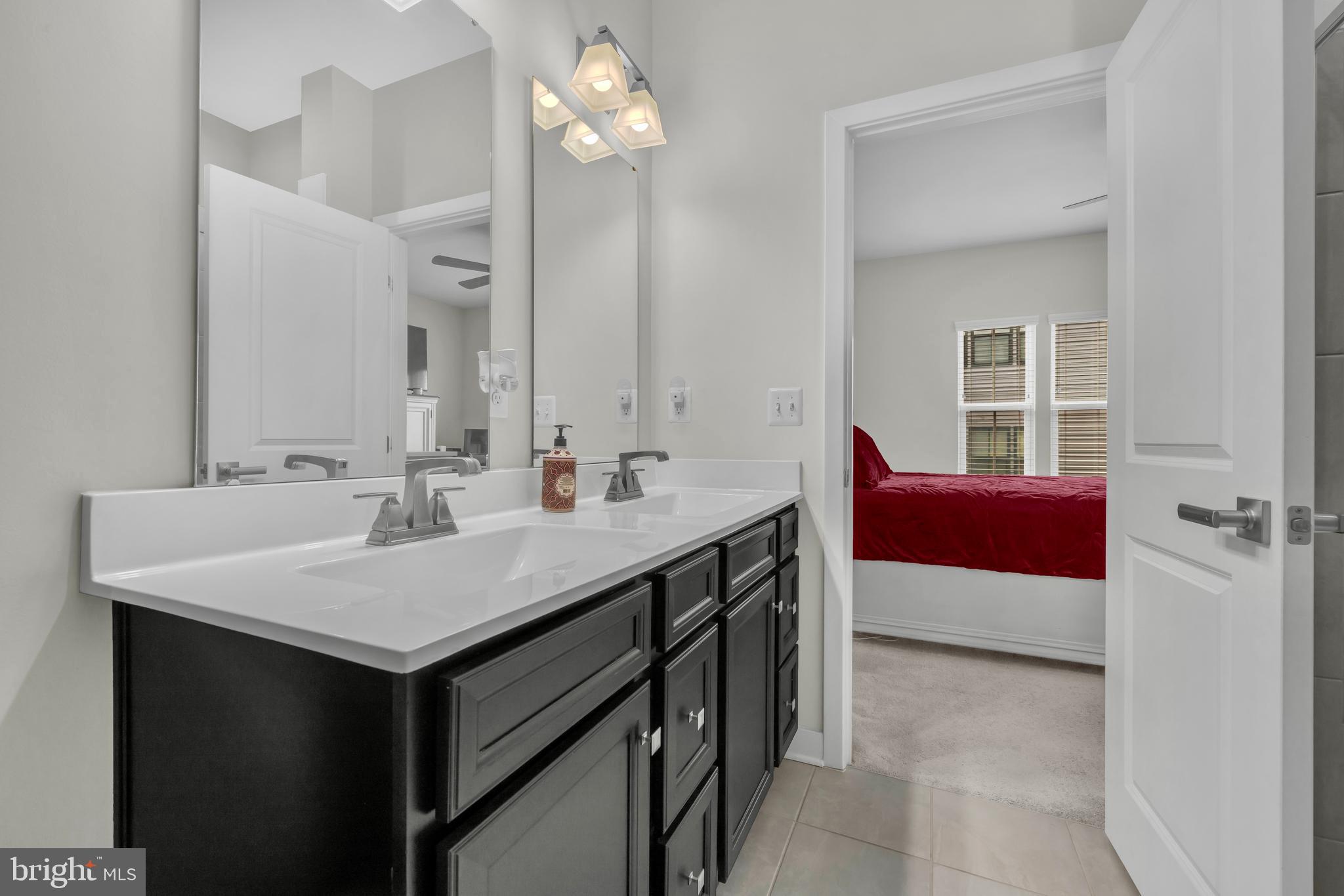 7111 Sollers Point Road Baltimore, MD 21222 - Photo 19 of 61 a bathroom with a sink and a mirror