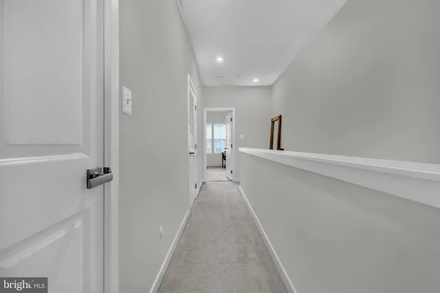 a spacious bathroom with a sink and a mirror
