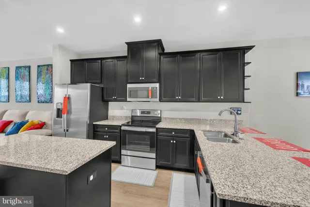 a kitchen with a table and chairs