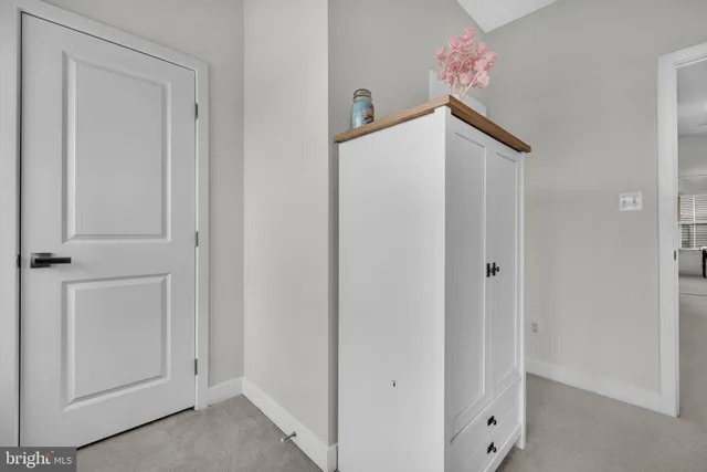 a bathroom with a sink vanity mirror and toilet