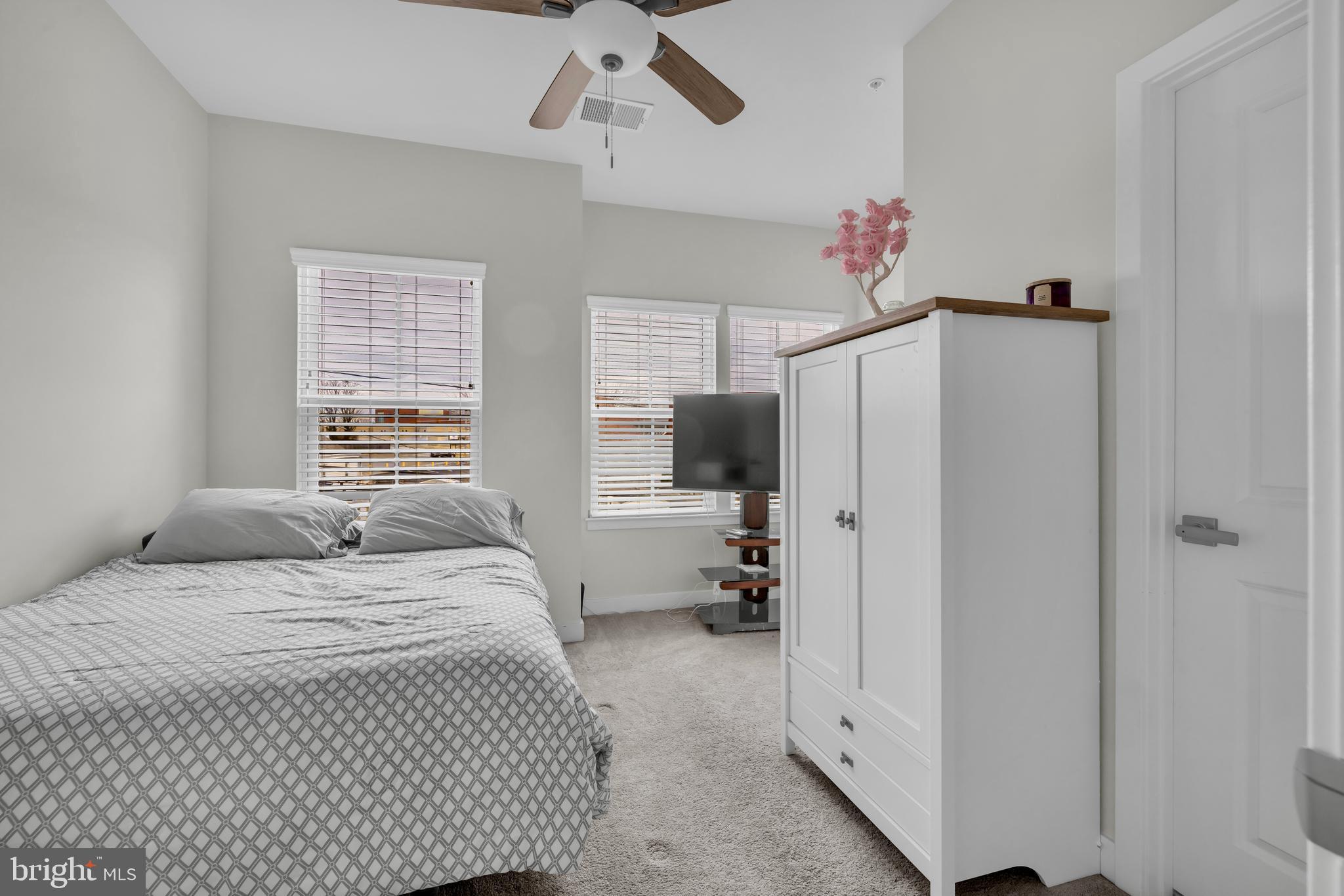 7111 Sollers Point Road Baltimore, MD 21222 - Photo 29 of 61 a bedroom with a bed and a flat screen tv