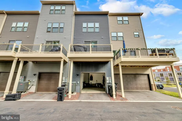 a view of walk in closet with clothes