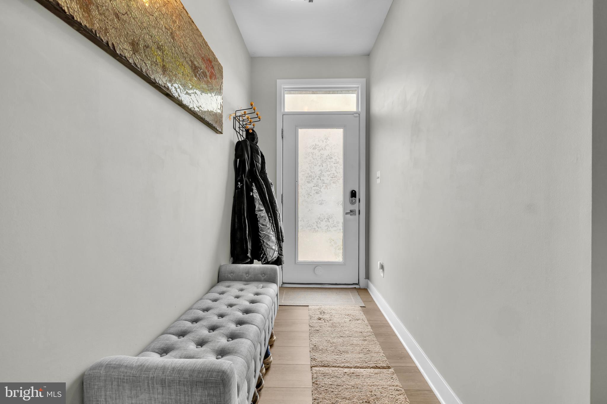 7111 Sollers Point Road Baltimore, MD 21222 - Photo 40 of 61 a view of a hallway with windows and stairs