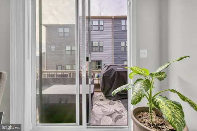 a living room with furniture and a fireplace with wooden floor