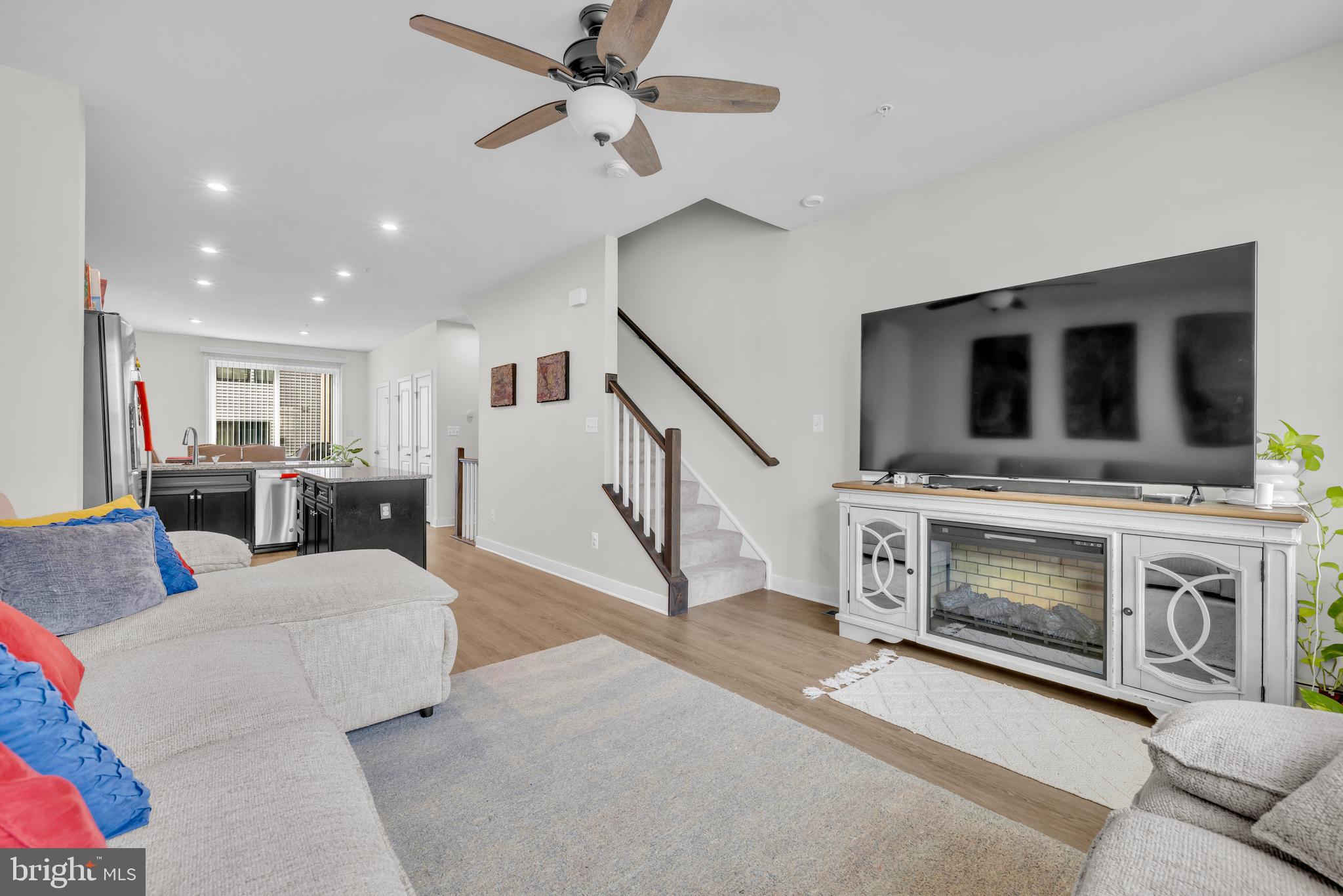 7111 Sollers Point Road Baltimore, MD 21222 - Photo 8 of 61 a living room with furniture and a fireplace with wooden floor