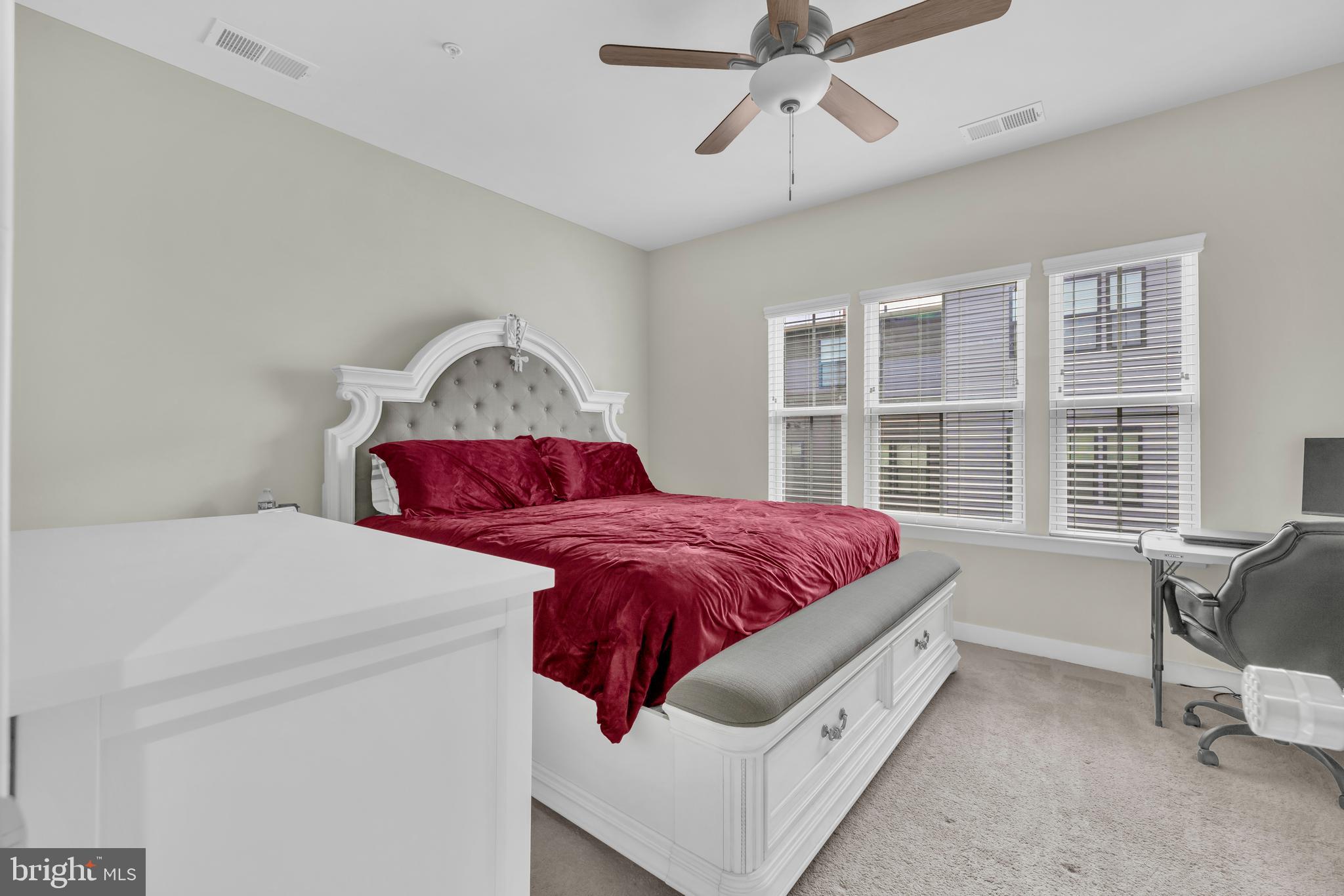 7111 Sollers Point Road Baltimore, MD 21222 - Photo 10 of 61 a spacious bedroom with a bed and window