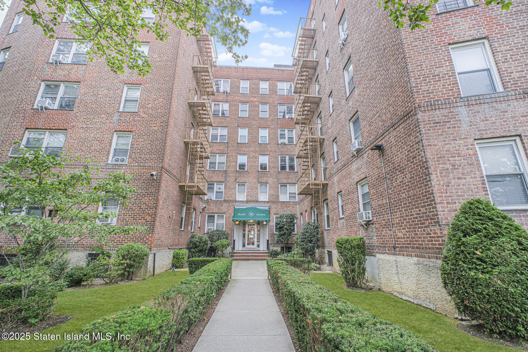 36 Dahill Road, Unit 4F Brooklyn, NY 11218 - Photo 1 of 25 a view of a brick building next to a big yard