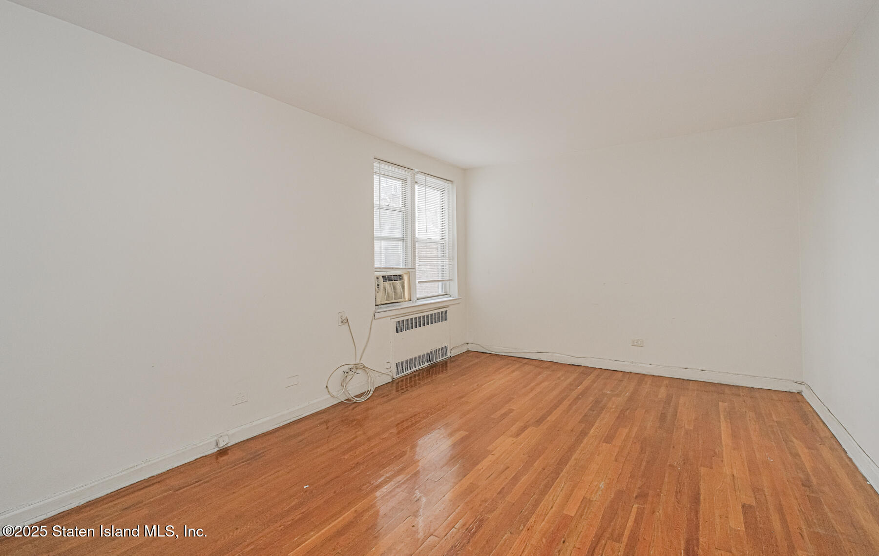 36 Dahill Road, Unit 4F Brooklyn, NY 11218 - Photo 16 of 25 a view of an empty room and wooden floor