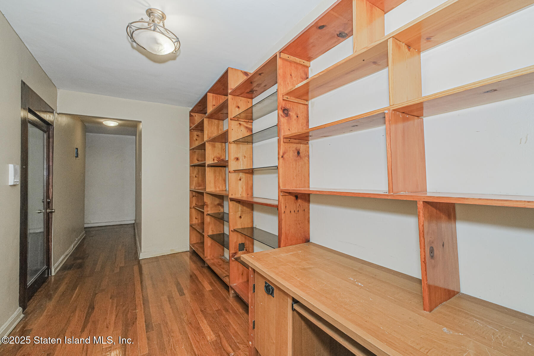 36 Dahill Road, Unit 4F Brooklyn, NY 11218 - Photo 4 of 25 a view of a room with wooden floor and staircase