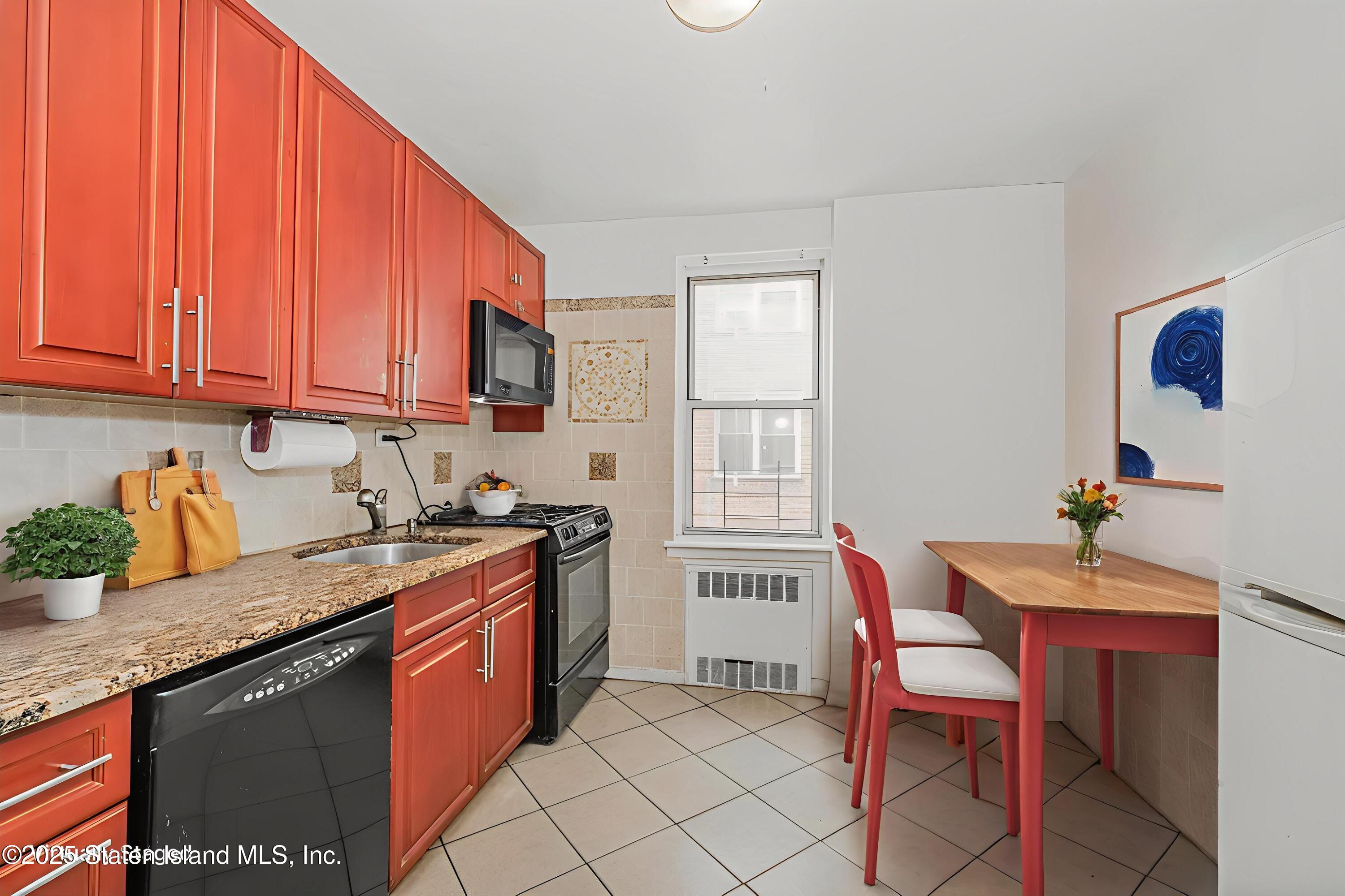 36 Dahill Road, Unit 4F Brooklyn, NY 11218 - Photo 7 of 25 a kitchen with stainless steel appliances granite countertop a sink stove and cabinets