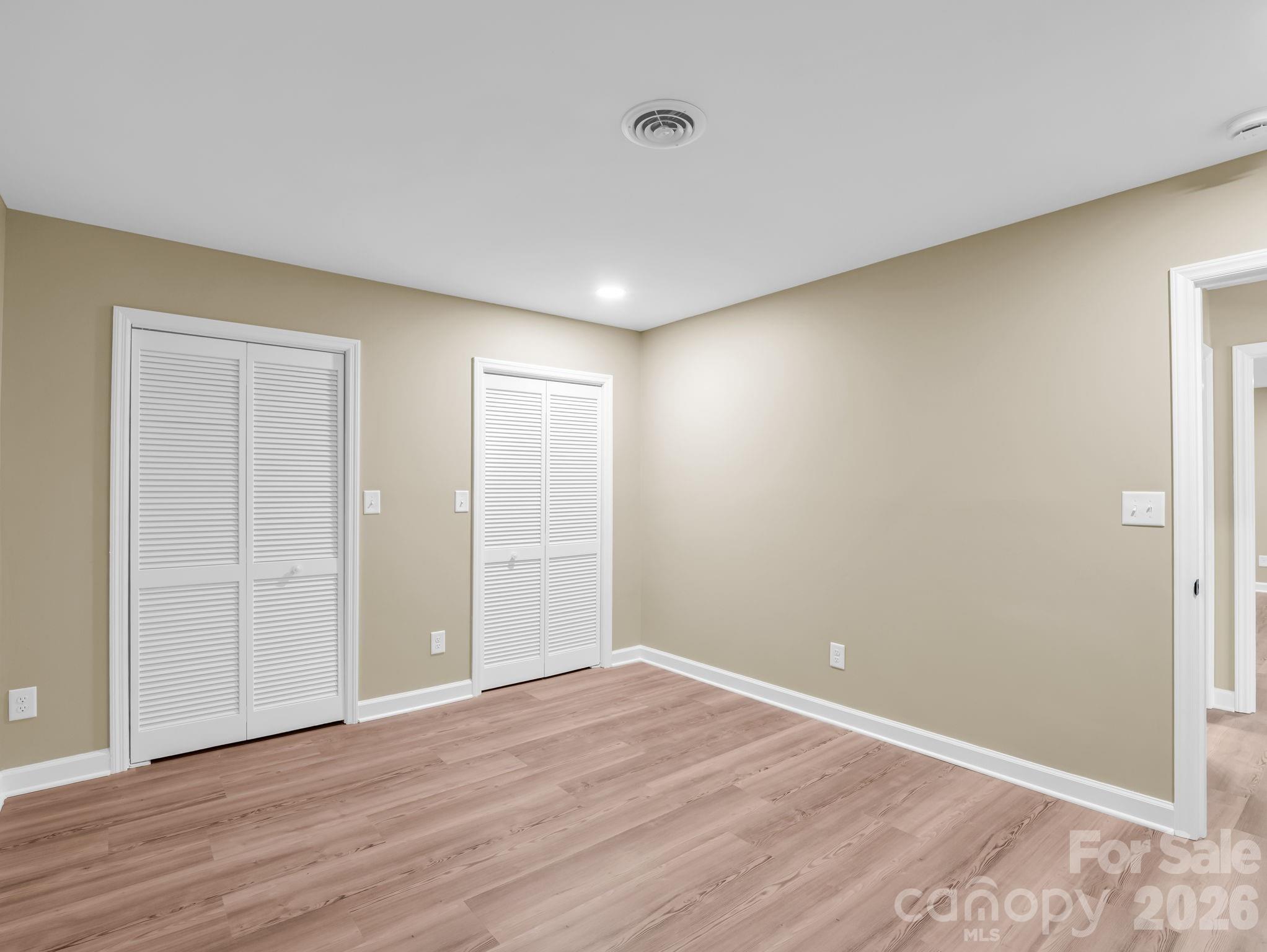 44 Jervey Road, Unit 4C Tryon, NC 28782 - Photo 26 of 35 a view of an empty room with wooden floor and closet