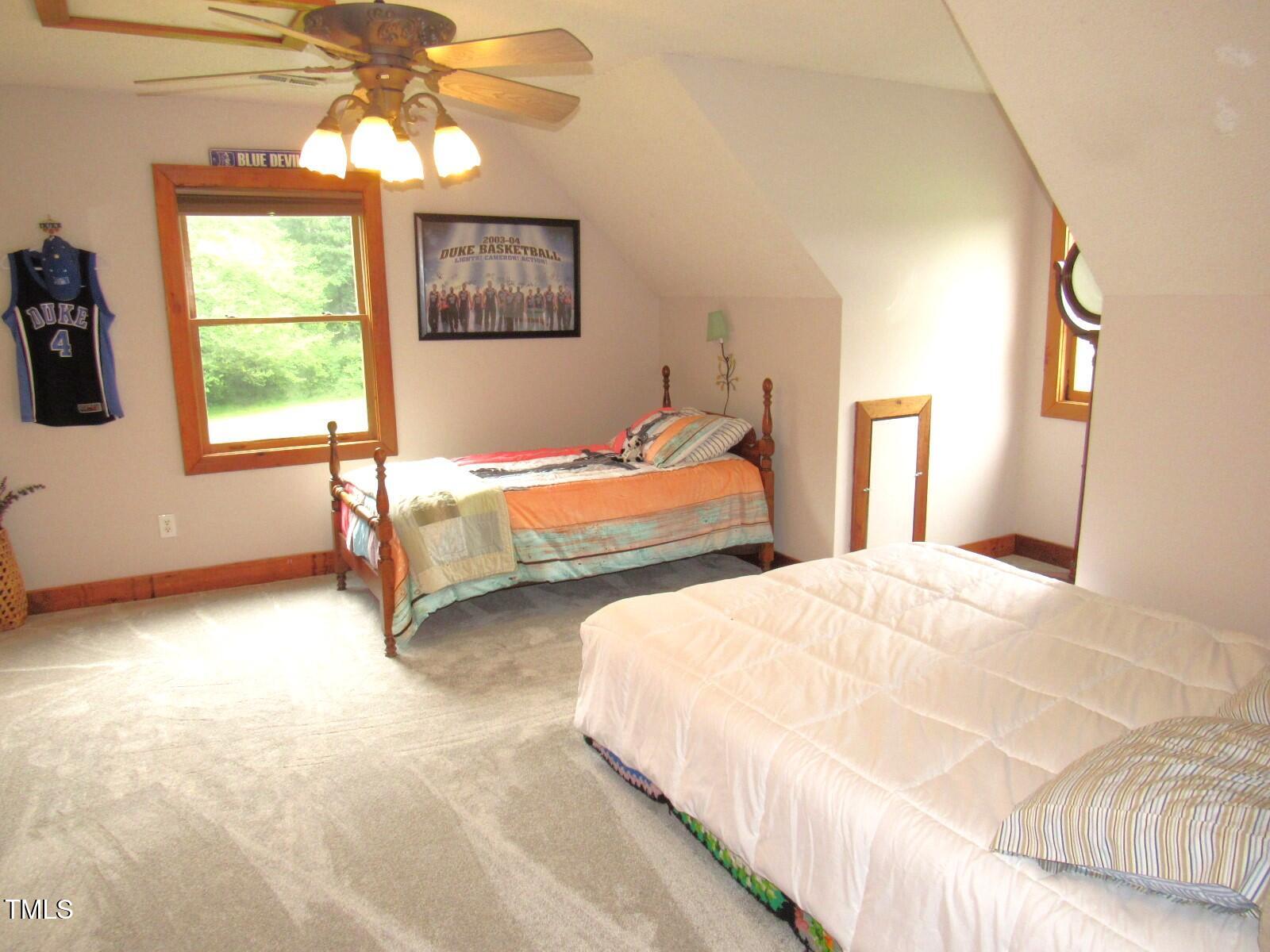 1159 Flemingtown Road Henderson, NC 27537 - Photo 22 of 51 a bedroom with two beds and painted walls