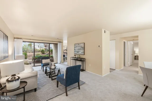 a living room with furniture and a area