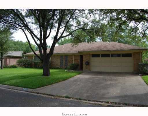 a house with trees in the background