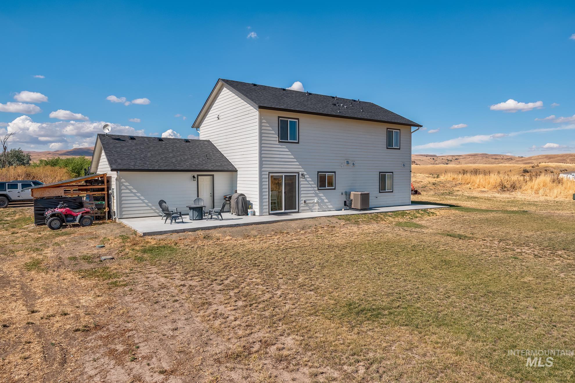 1049 Price Road Weiser, ID 83672 - Photo 44 of 47 Two-story residence featuring white horizontal siding and a dark shingle roof