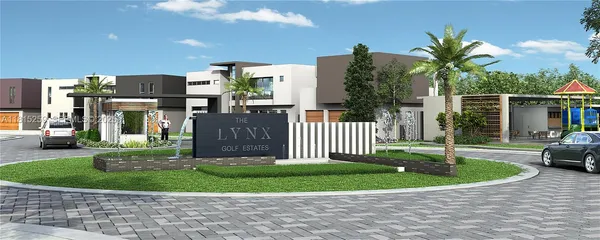 a view of a house with a small yard and plants