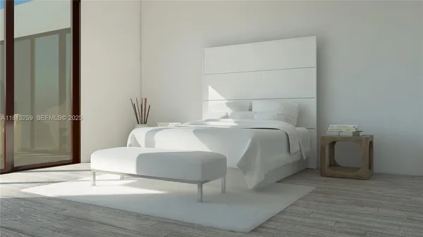 a bedroom with a bed and a mirror