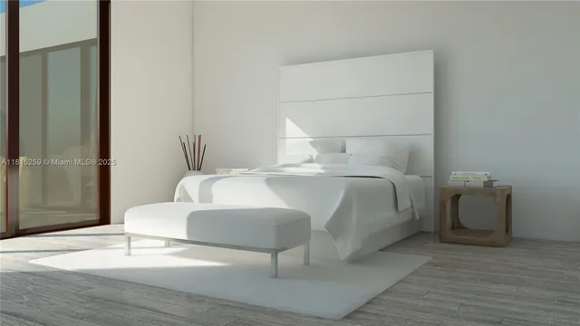 a bedroom with a bed and a mirror