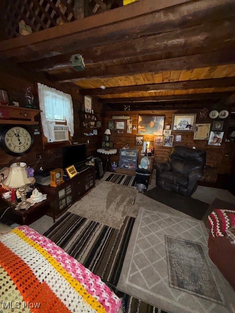 15639 Grove Road Southwest Port Washington, OH 43837 - Photo 16 of 31 Living area with wood walls and a wooden ceiling with exposed beams
