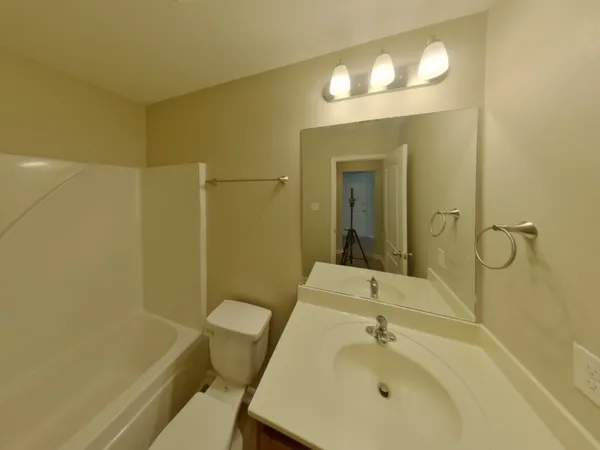 a bathroom with a shower and a toilet