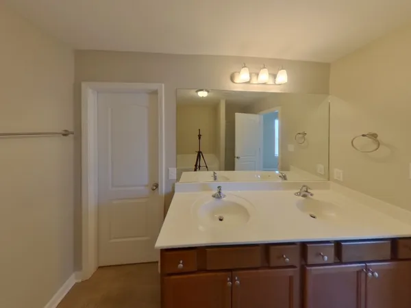 a bathroom with a sink a vanity and a mirror