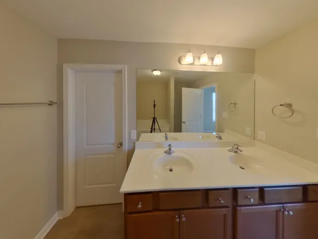 a bathroom with a sink a vanity and a mirror