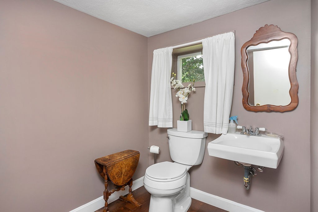 81 Cornell Road Marblehead, MA 01945 - Photo 23 of 28 a bathroom with a toilet sink and mirror
