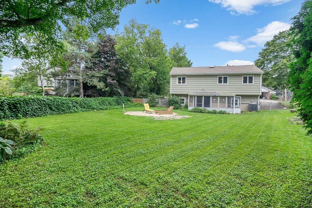 81 Cornell Road Marblehead, MA 01945 - Photo 26 of 28 a view of a house with a big yard and large trees