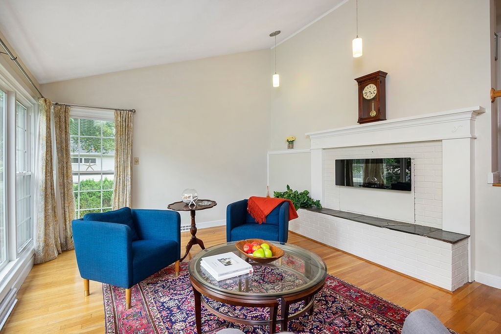81 Cornell Road Marblehead, MA 01945 - Photo 4 of 28 a living room with furniture and a fireplace