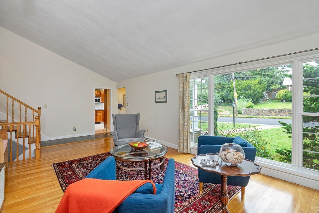 81 Cornell Road Marblehead, MA 01945 - Photo 6 of 28 a living room with furniture and a floor to ceiling window