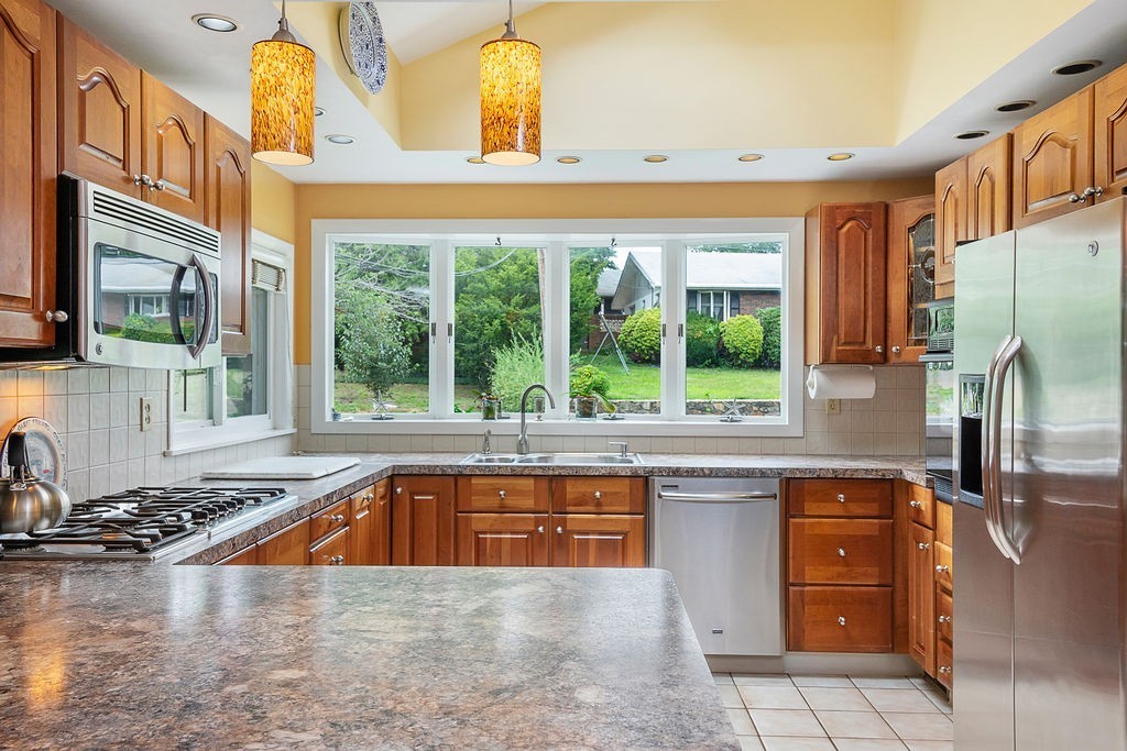 81 Cornell Road Marblehead, MA 01945 - Photo 9 of 28 a kitchen with a sink a stove and cabinets