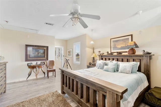 a bedroom with a bed and a table