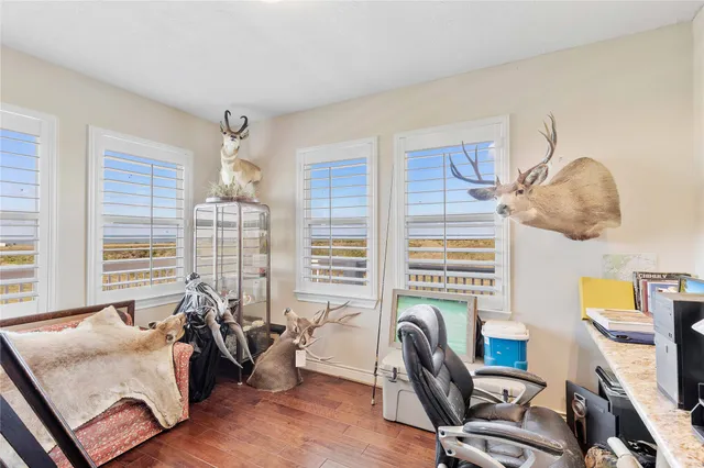 a work room with furniture and a window