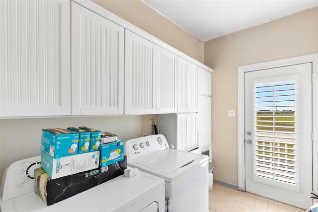 a room with a baby crib furniture and a window