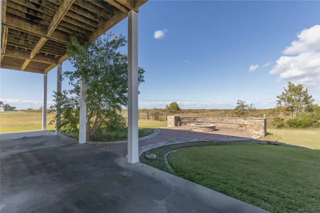 a view of a yard with an ocean view
