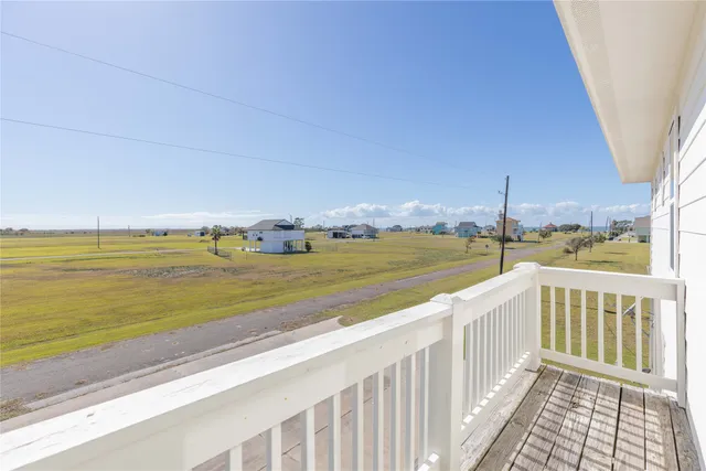 a view of a balcony with ocean view