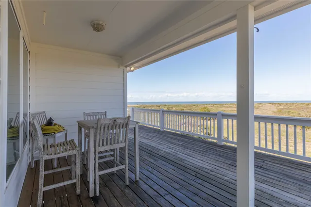 a view of a balcony with chairs