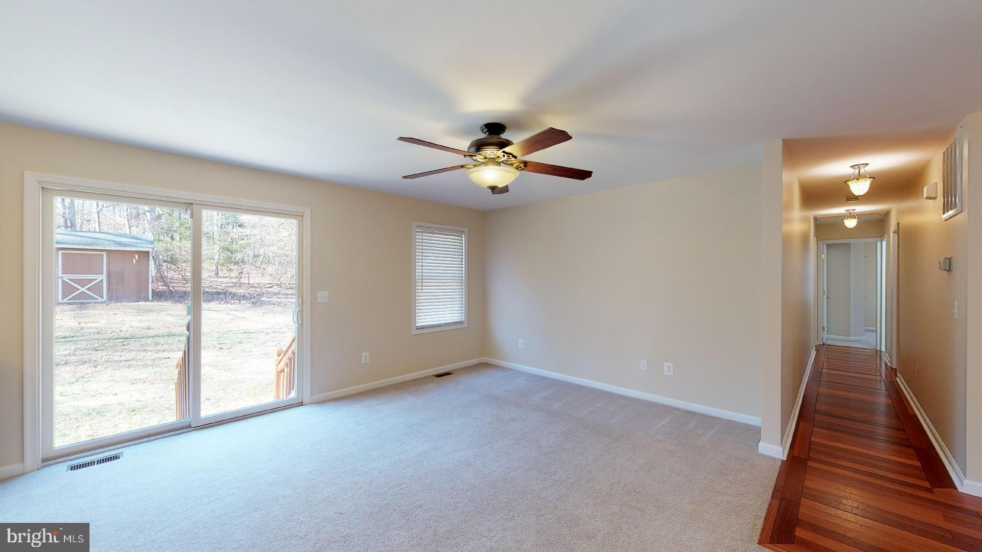 23015 Newtowne Neck Road Leonardtown, MD 20650 - Photo 5 of 31 family room & hallway to bedrooms