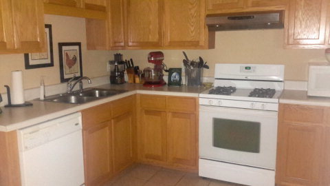 2100 Allen Road Culloden, GA 31016 - Photo 15 of 19 a kitchen with stainless steel appliances granite countertop a sink stove and microwave