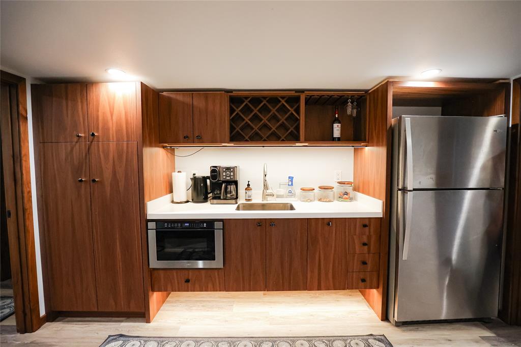 1250 County Road Brady, TX 76825 - Photo 20 of 40 a kitchen with a sink and a refrigerator