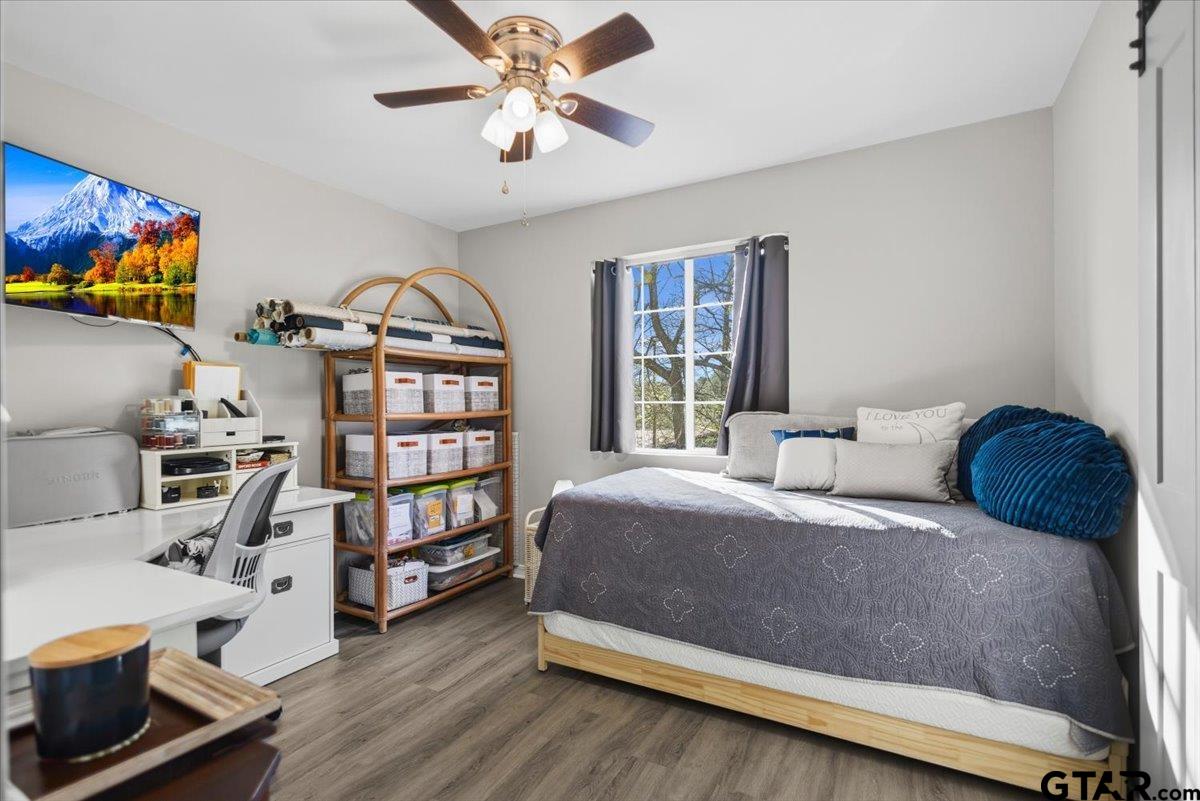 289 Acapulco Road Jefferson, TX 75657 - Photo 16 of 30 a bedroom with a bed furniture and a window