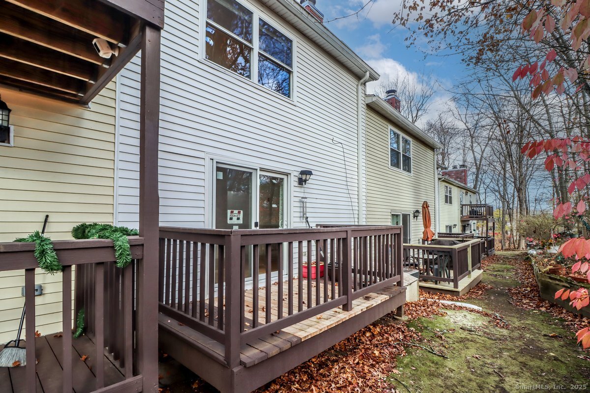 25 Padanaram Road, Unit 30 Danbury, CT 06811 - Photo 17 of 24 a view of a deck with couches and wooden floor