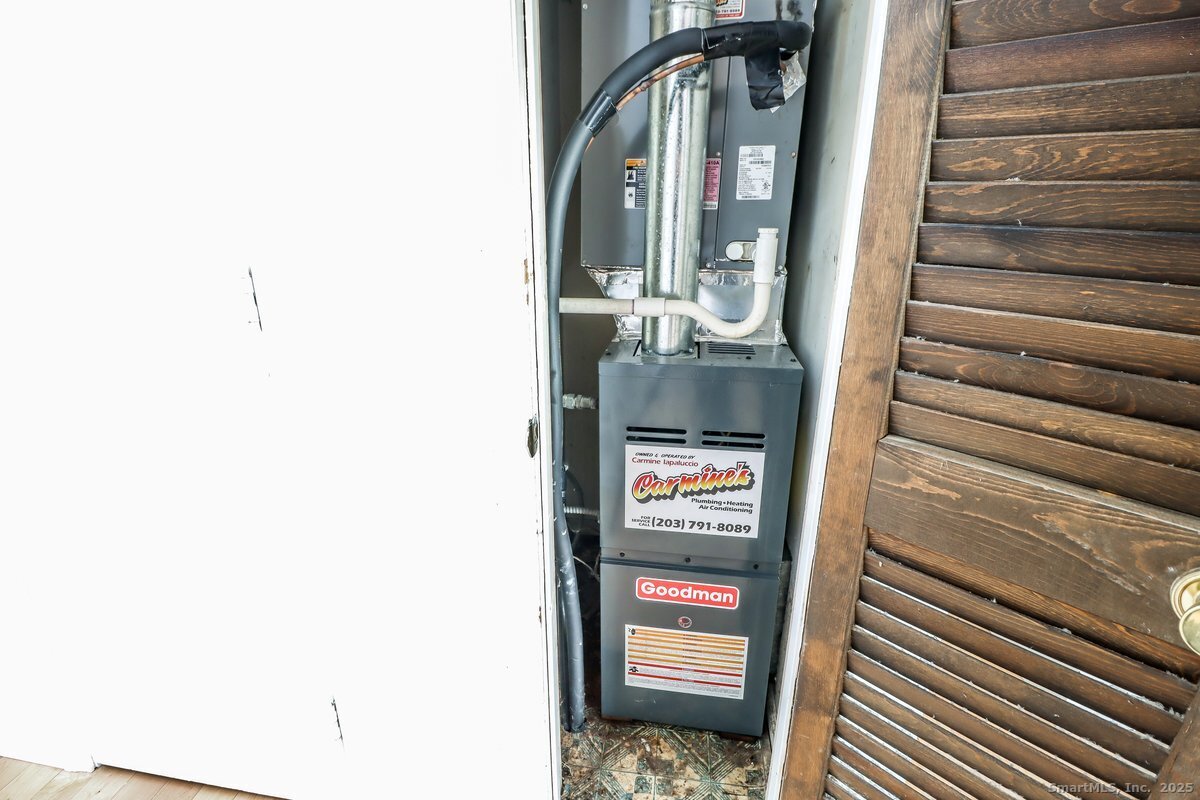 25 Padanaram Road, Unit 30 Danbury, CT 06811 - Photo 19 of 24 a view of a hallway with wooden floor